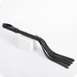 a black bdsm whip