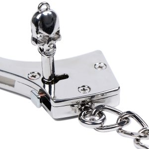 ready to open a silver stainless steel handcuffs use key