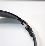 a black belt of bdsm masks on table