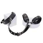 a collar and 2 shackles connected by leather chain, black