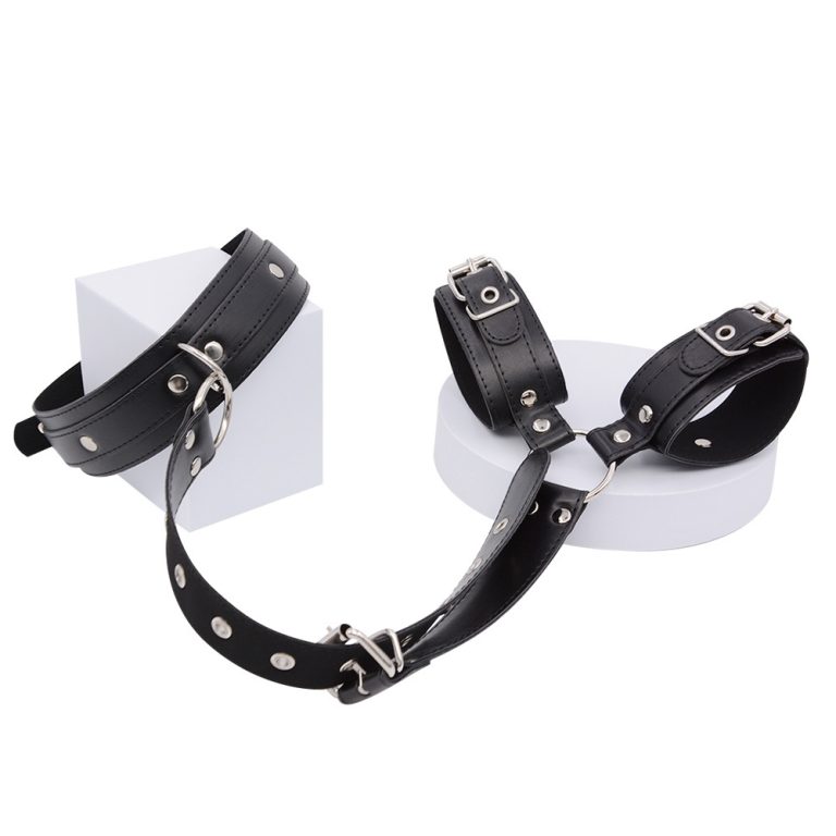 a collar and 2 shackles connected by leather chain, black