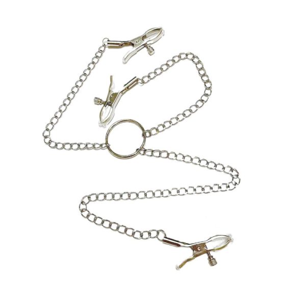 a silver nipple and clitoral clamps